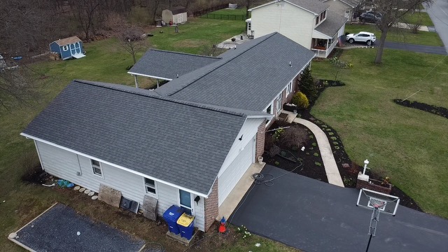 professional roofer repairing the roof