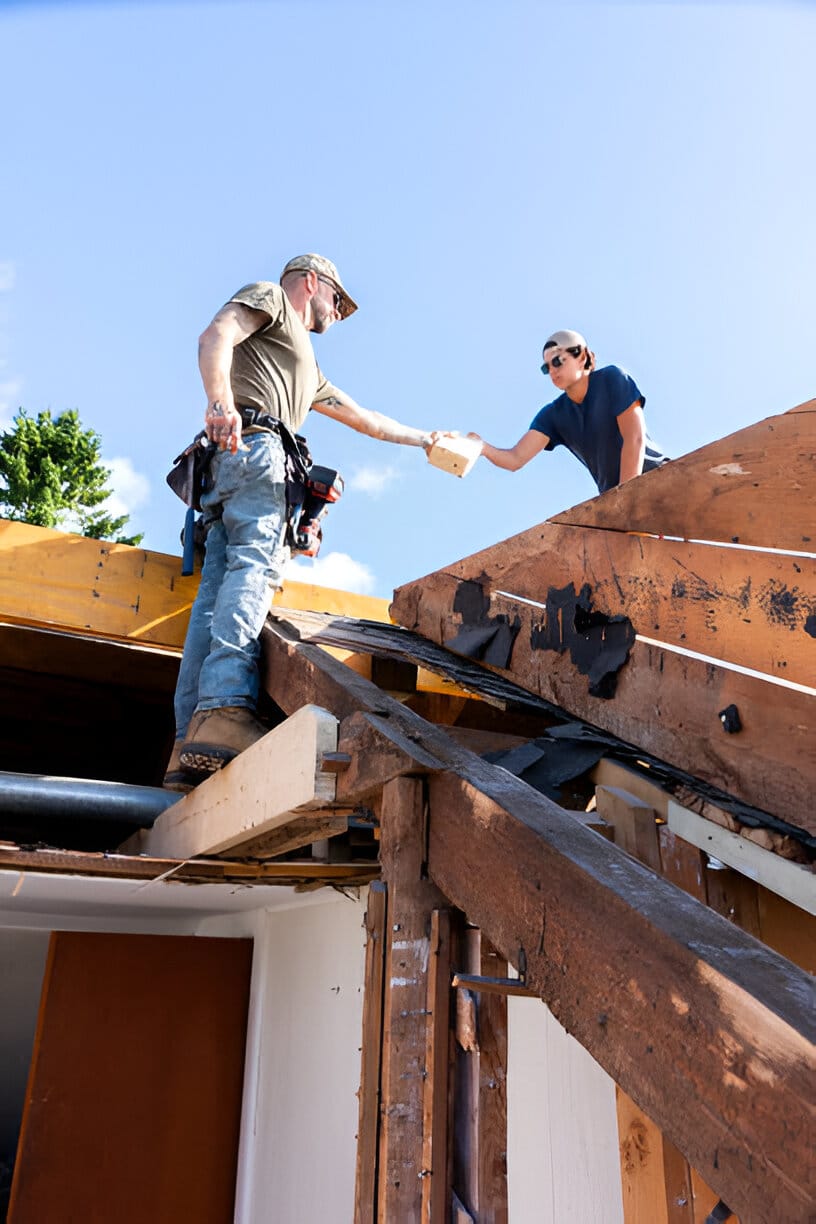 Roof repairs being performed on a church 