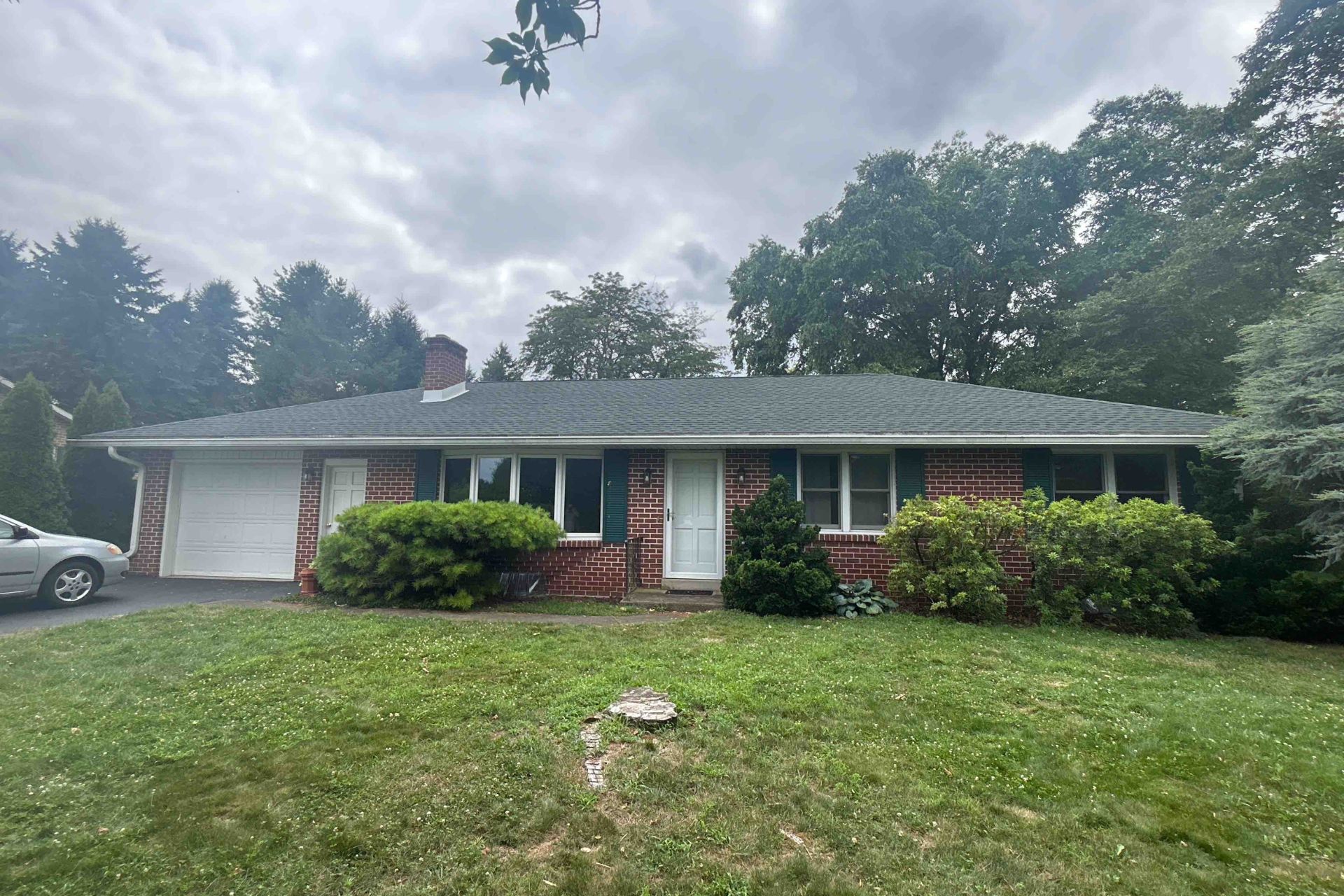 Damaged roof with missing shingles prior to a repair made by DePalma Roofing & Construction in Mechanicsburg, PA