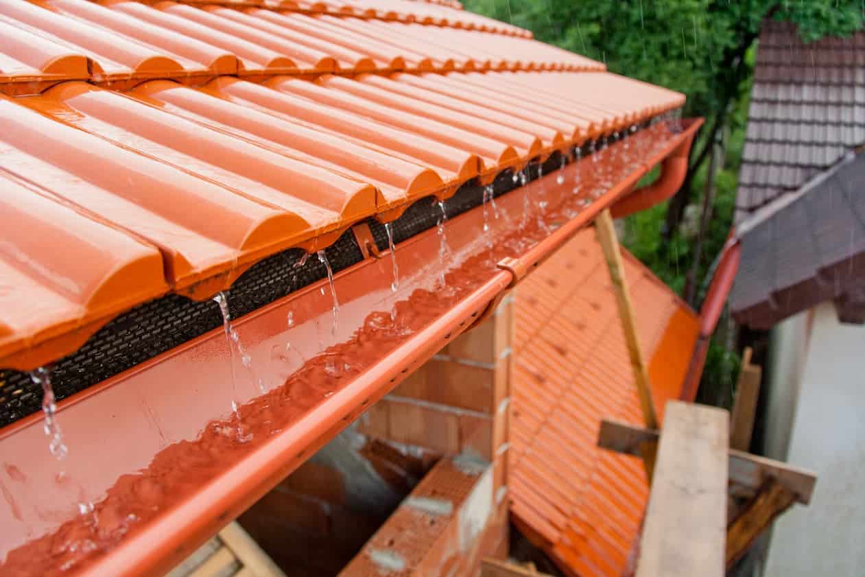 roof gutter showing rainwater flowing