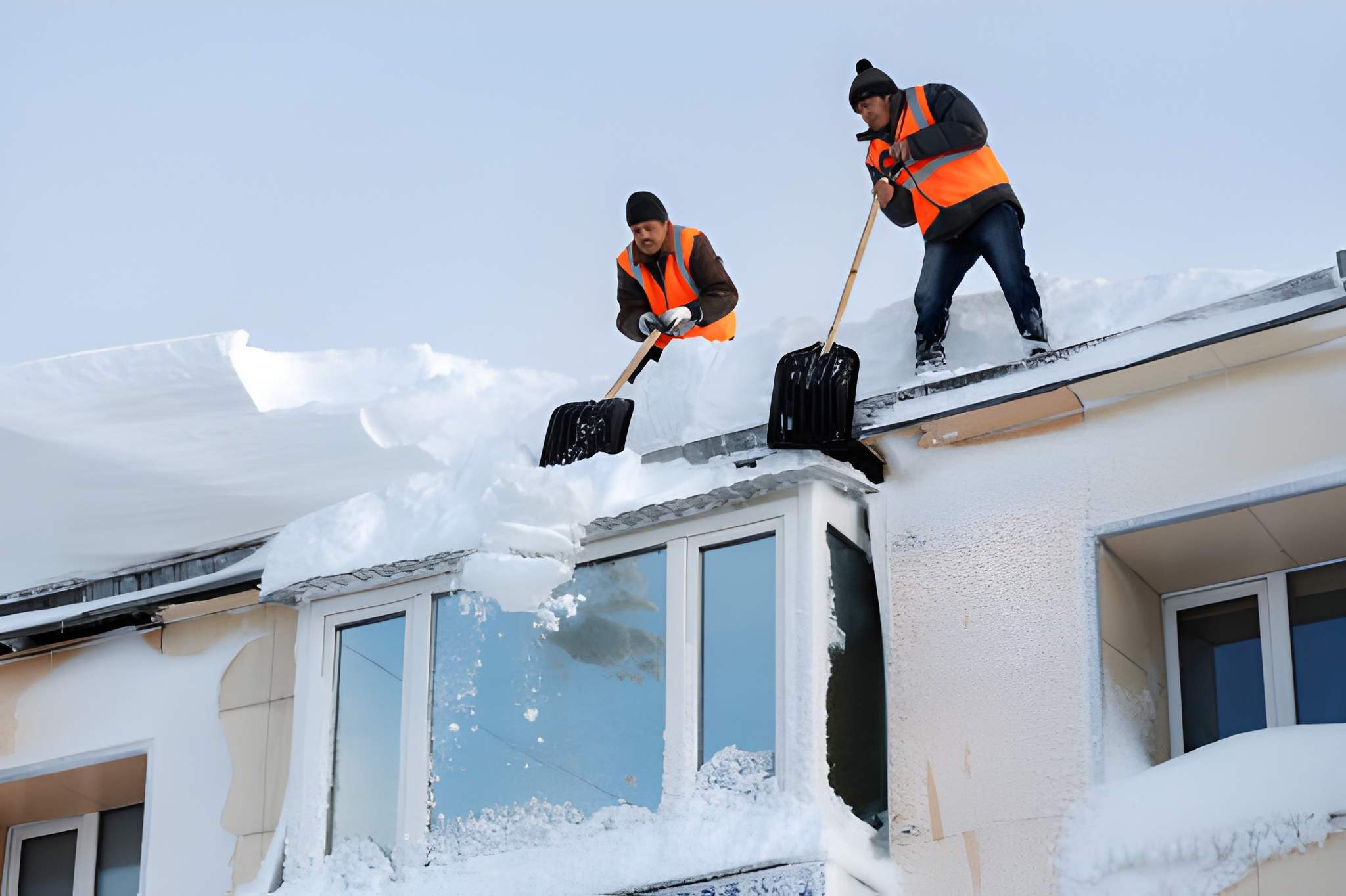 winter cleaning of roof of building