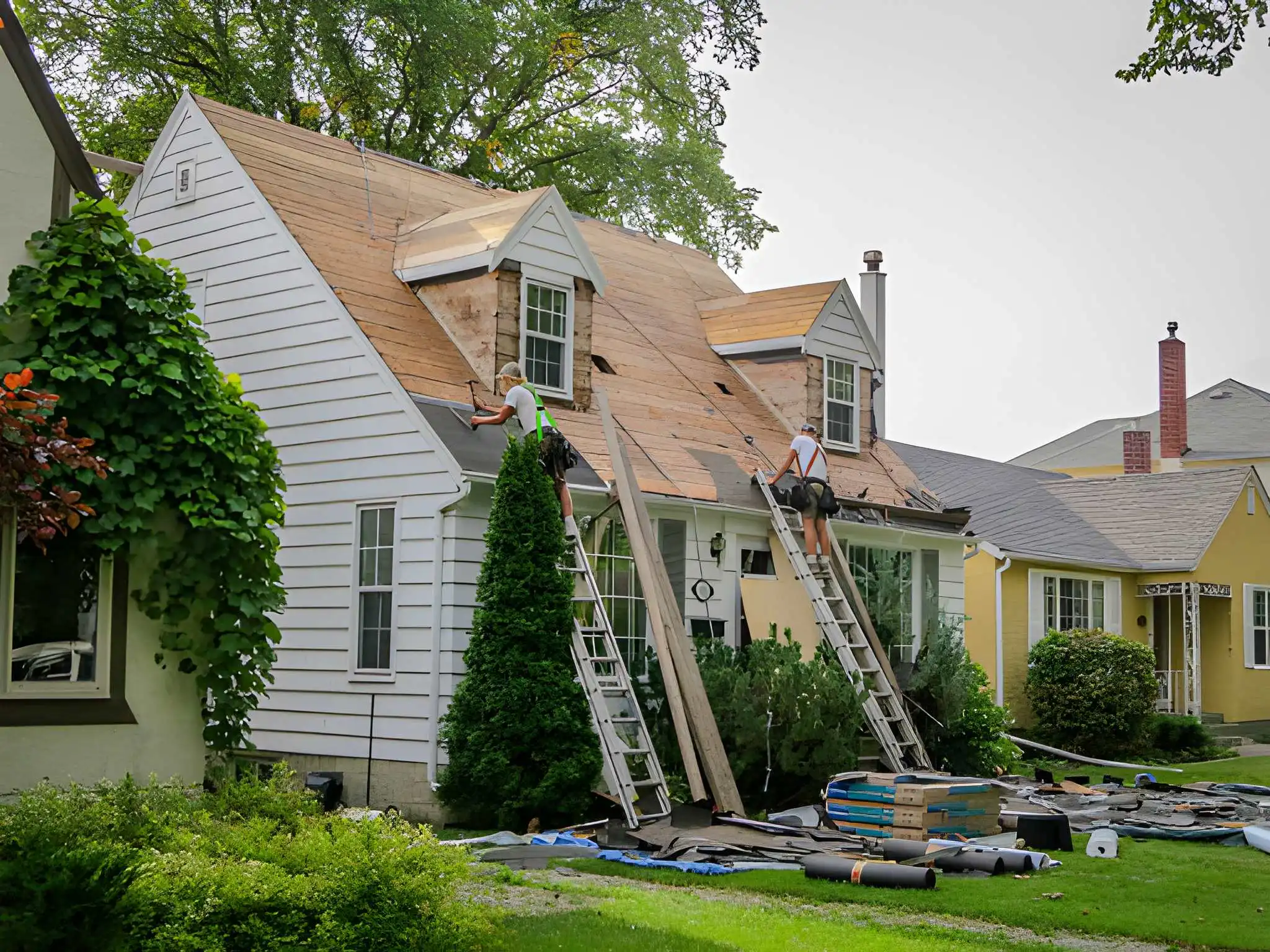 ladders propped against the two-story home frame